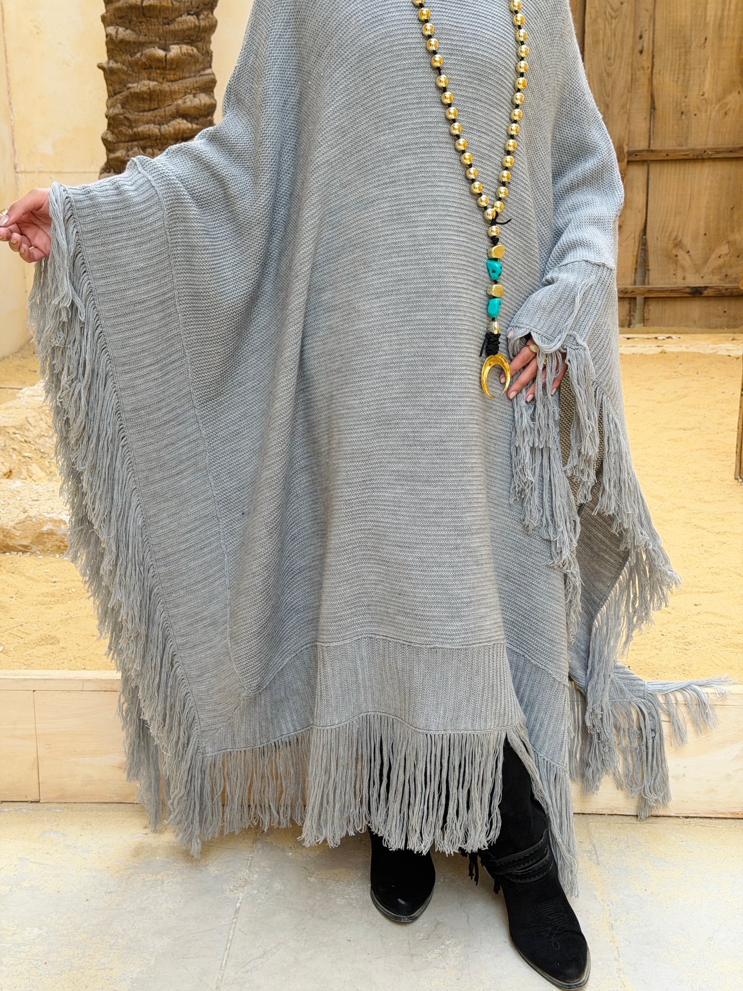 نَفَس — Nafas
Tassel Knitted Cape in Grey