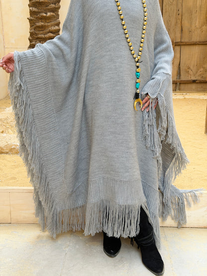نَفَس — Nafas
Tassel Knitted Cape in Grey