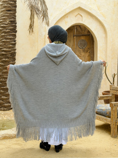 نَفَس — Nafas
Tassel Knitted Cape in Grey
