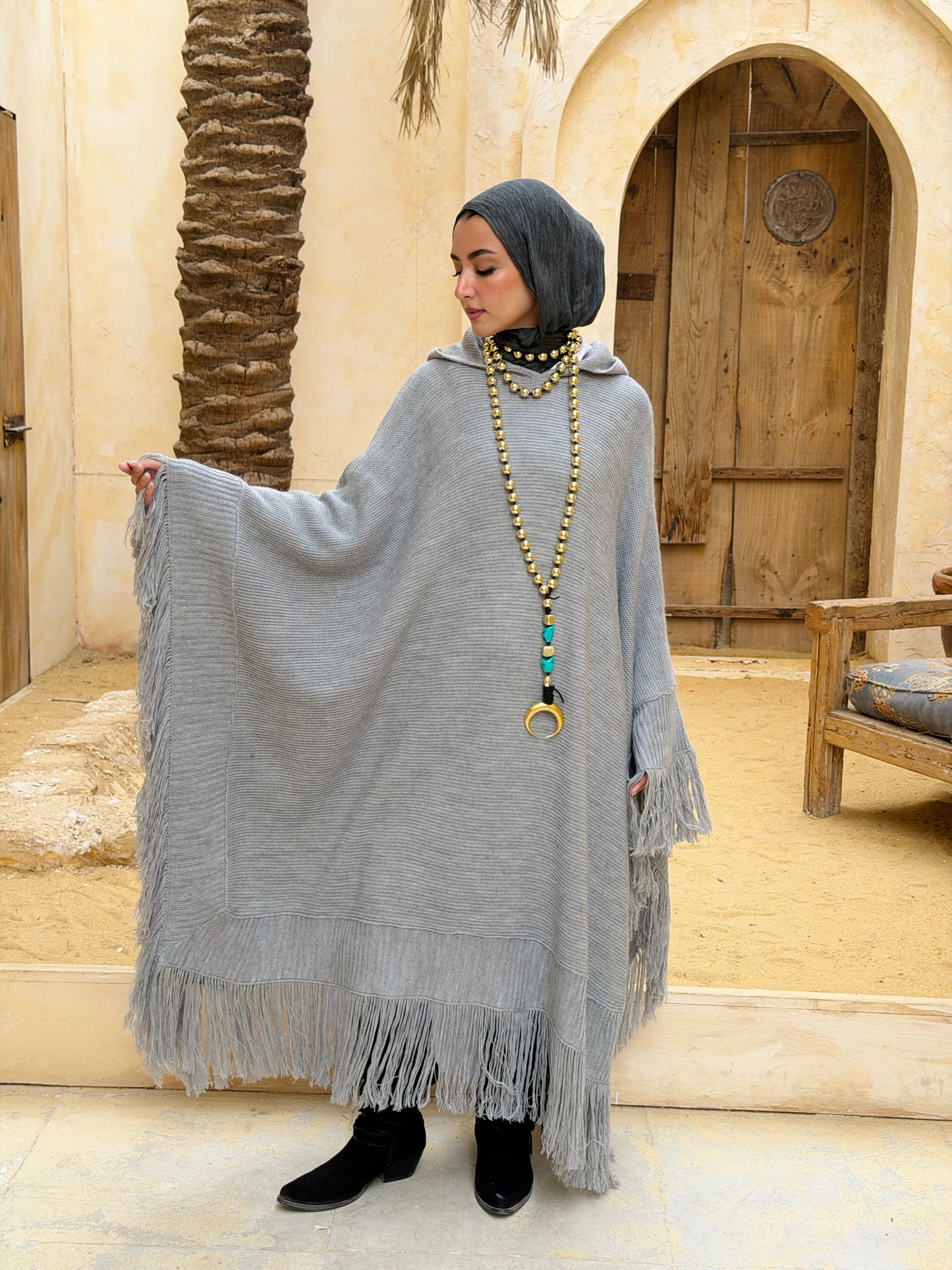 نَفَس — Nafas
Tassel Knitted Cape in Grey
