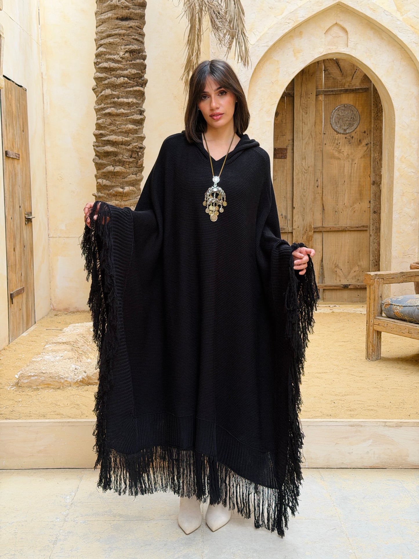 نَفَس — Nafas
Tassel Knitted Cape in black
