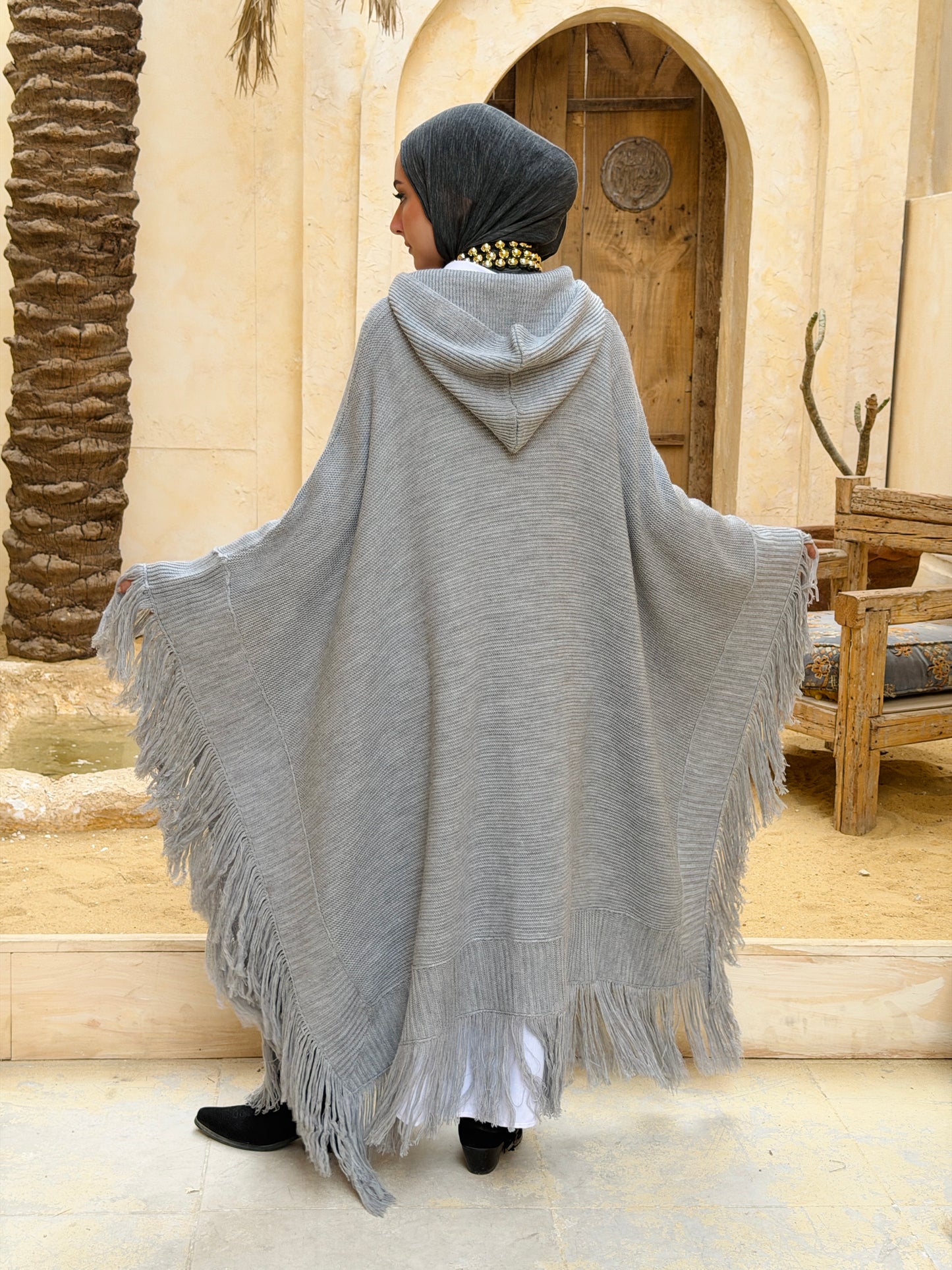 نَفَس — Nafas
Tassel Knitted Cape in Grey