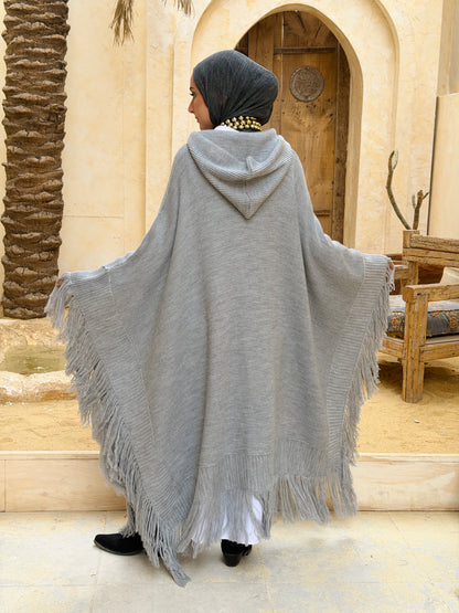 نَفَس — Nafas
Tassel Knitted Cape in Grey