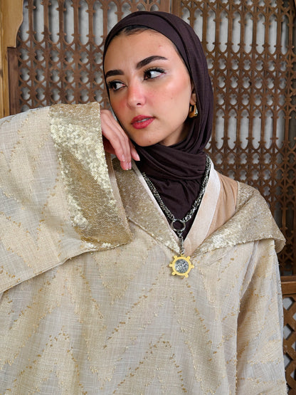 نُقْيَة — Noqya
Linen golden Kaftan