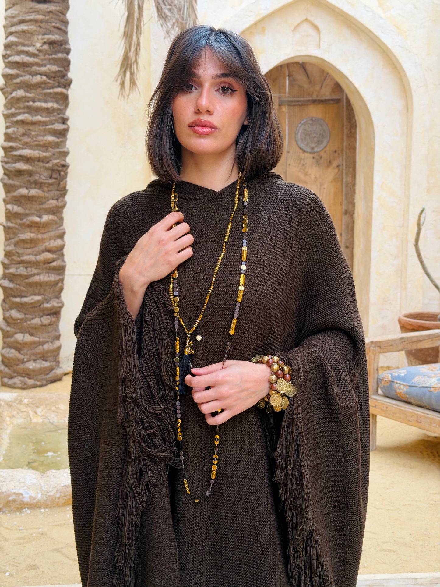 نَفَس — Nafas
Tassel Knitted Cape in brown