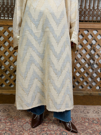 نُقْيَة — Noqya
Linen golden Kaftan