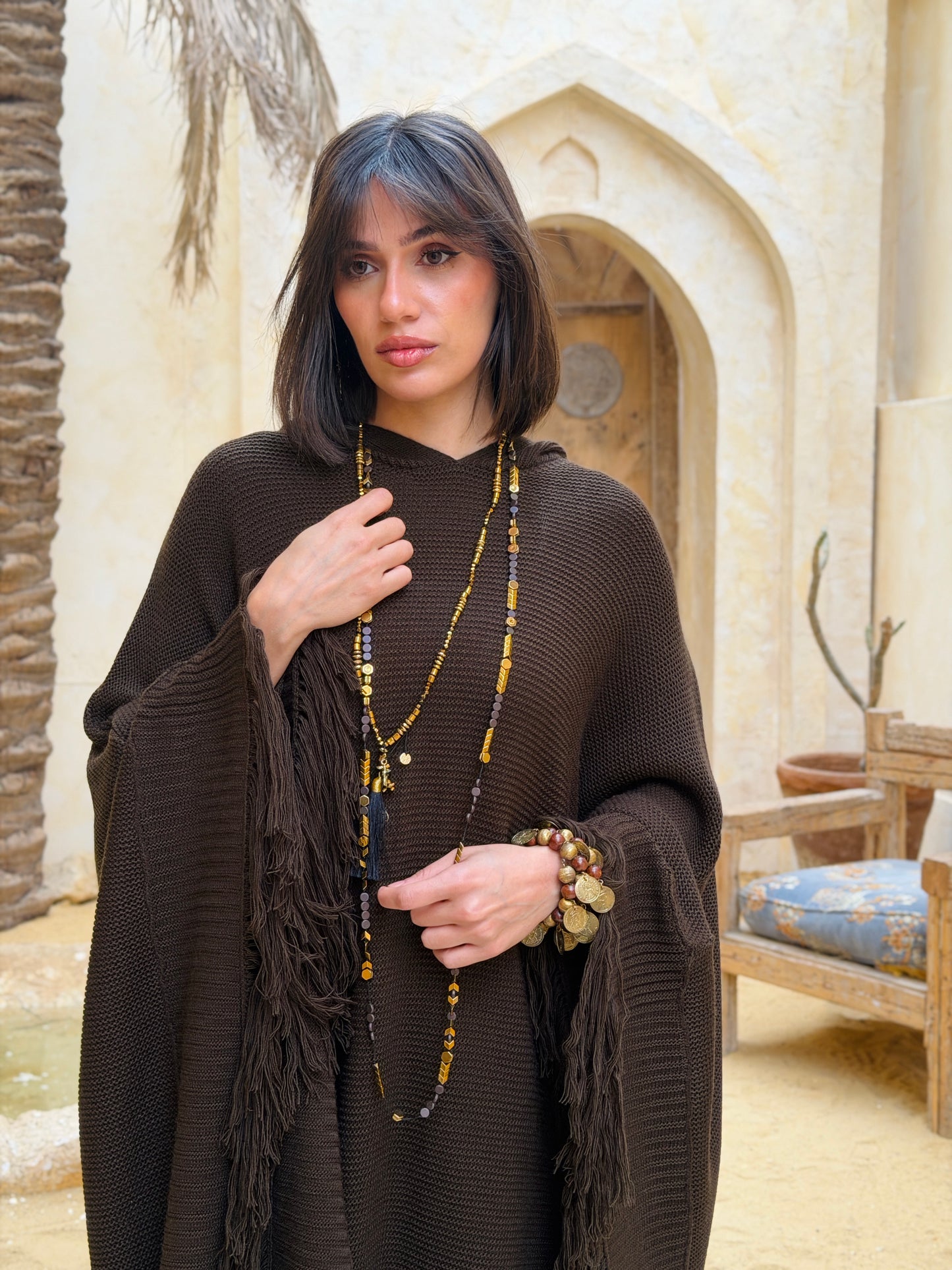 نَفَس — Nafas
Tassel Knitted Cape in brown