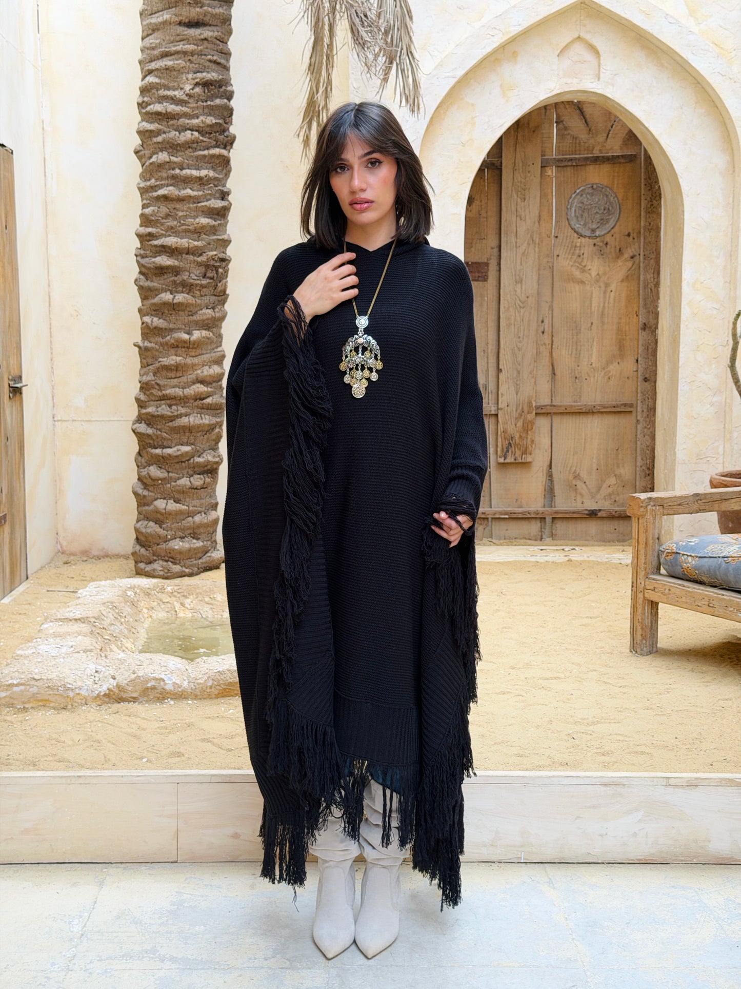 نَفَس — Nafas
Tassel Knitted Cape in black