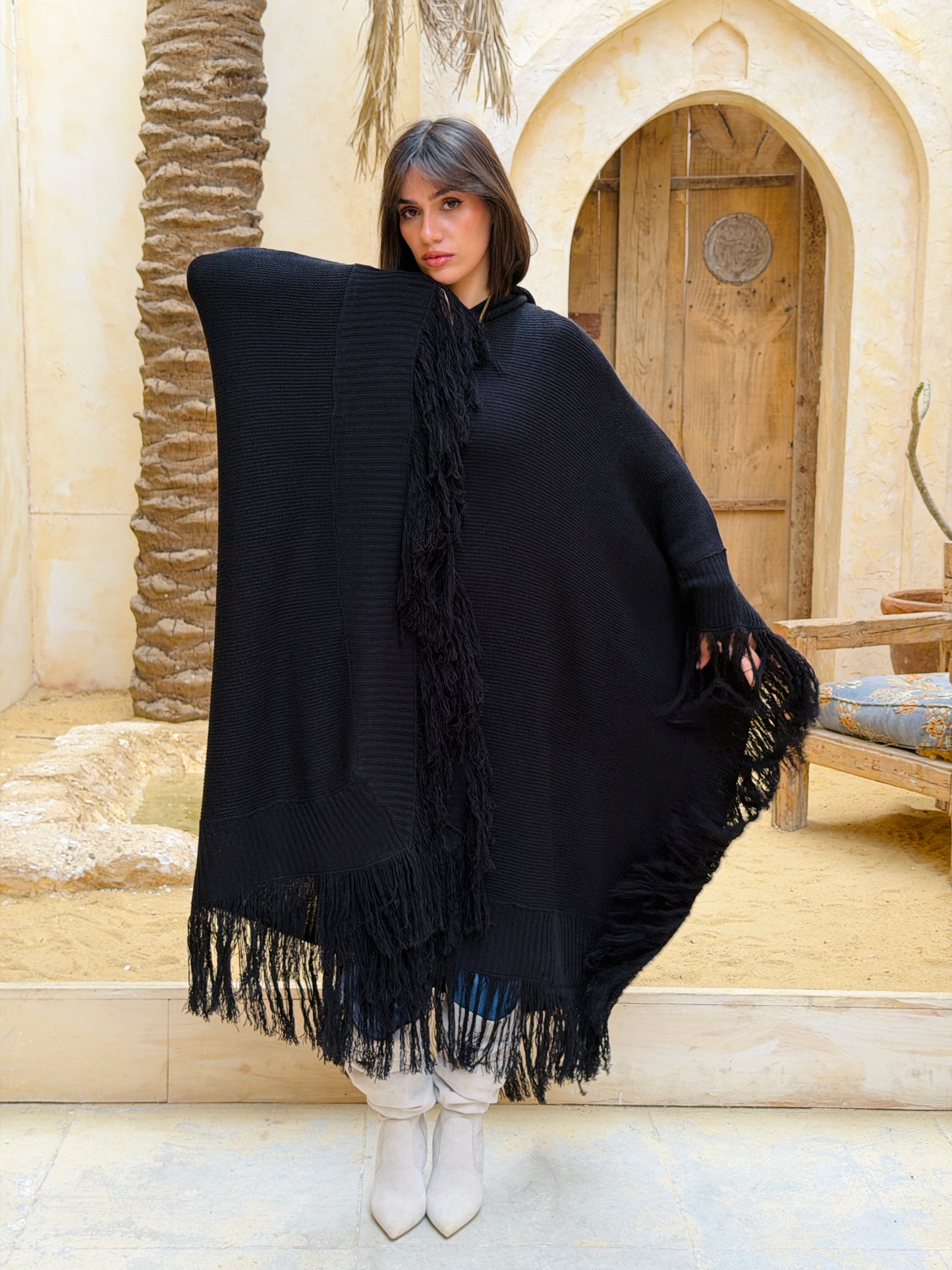 نَفَس — Nafas
Tassel Knitted Cape in black