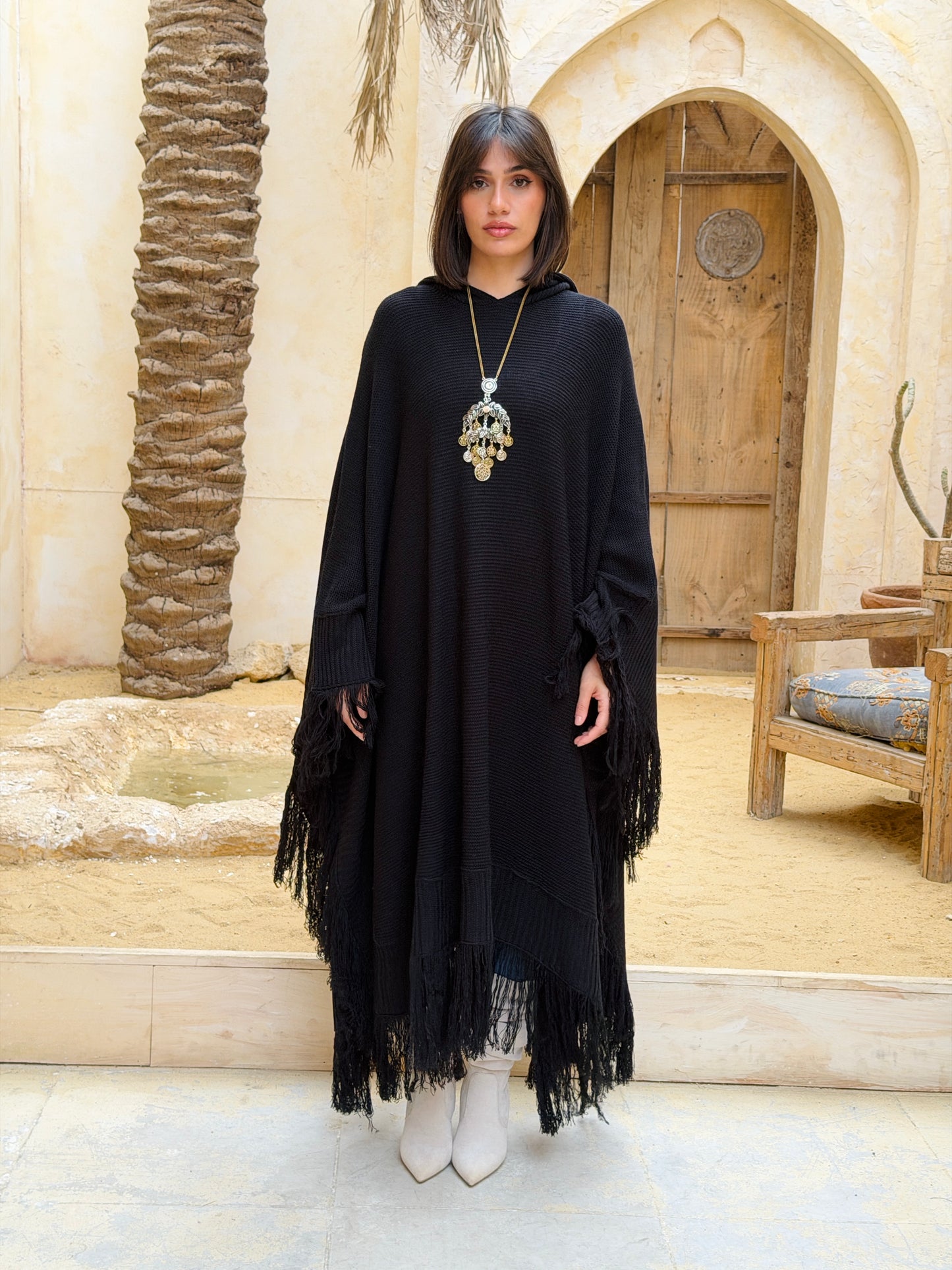 نَفَس — Nafas
Tassel Knitted Cape in black