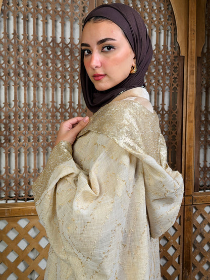 نُقْيَة — Noqya
Linen golden Kaftan