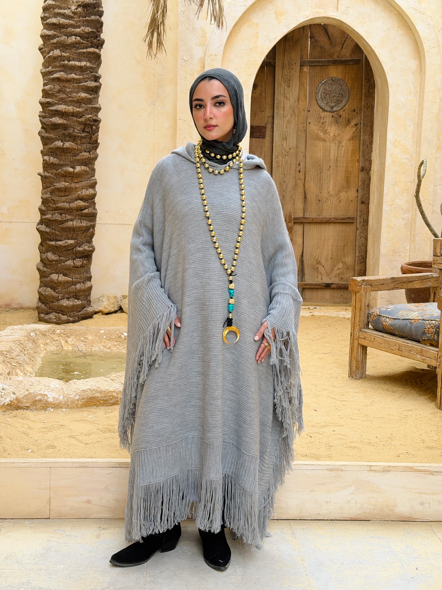 نَفَس — Nafas
Tassel Knitted Cape in Grey