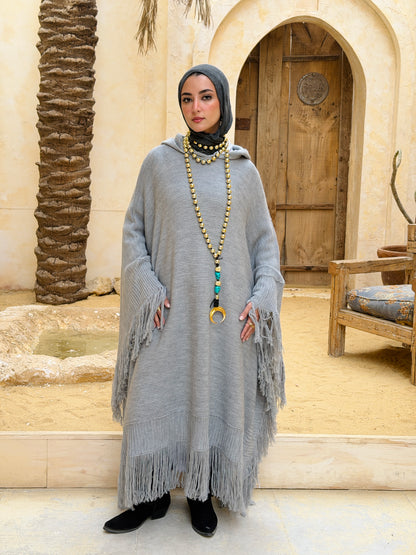 نَفَس — Nafas
Tassel Knitted Cape in Grey