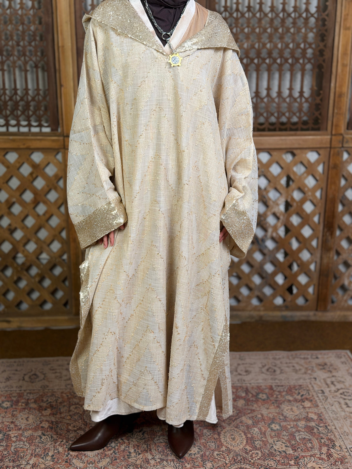 نُقْيَة — Noqya
Linen golden Kaftan