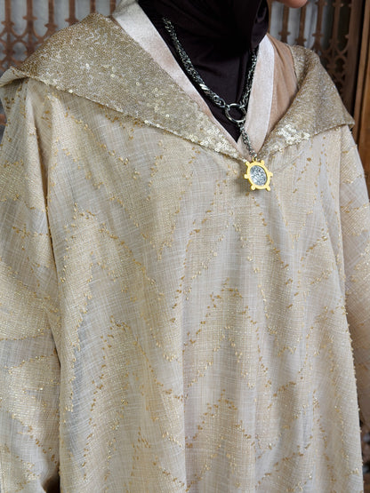 نُقْيَة — Noqya
Linen golden Kaftan